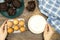 Woman holding a bowl of flour and eggs for prepare cake, homemade chocolate muffins on wooden table