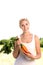 Woman holding bunch of carrots