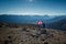 Woman holding a Canadian flag in the Canadian Rocky Mountains Rockies in Jasper National Park, Alberta, Canada