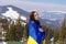 Woman holding,carring ukrainian national blue yellow flag.war,conflict,military invasion beetwen Russia as terrorist aggressive