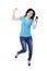 Woman holding cellphone and jumping