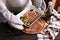 woman holding ceramic baking dish with baked aspargus covered with bacon