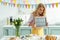 Woman holding chalkboard with happy easter