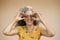 Woman holding chocolate madeleines to her eyes