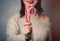 Woman holding a christmas lollipop