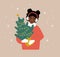 Woman holding Christmas tree in pot. African smiling girl preparing for winter holidays. People buying Christmas fir on