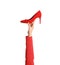 Woman holding classic high heeled shoe on white background