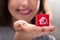 Woman Holding Cubic Block With Home Search Icon