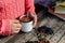 Woman holding cup of hot chocolate. Hot Chocolate in wooden tabl