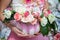 Woman holding Decorated Halloween pumpkin with flowers and leaves