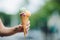 Woman holding delicious colorful ice cream.Summertime vibes and sweet food.