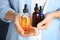 Woman holding different bottles with essential oils