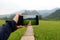 Woman holding digital tablet in field