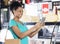 Woman Holding Digital Tablet In Grocery Store