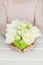 Woman holding eautiful spring floral arrangement with white tulips