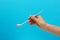 Woman holding empty soda spoon, closeup