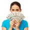 Woman Holding Fanned Out Dollars In Front Of Face