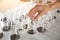 Woman holding flask with soil sample over table. Laboratory analysis