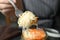 Woman holding fork with fermented cabbage