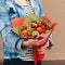 Woman holding fruit bouquet