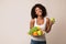 Woman holding fruits assortment served on plate