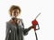 Woman holding fuel pump nozzle