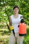 Woman holding garden spray