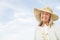 Woman Holding Gardening Equipment Against Sky