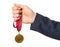 Woman holding golden medal on white background