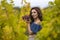 Woman Holding Grapes In Her Hand In Vineyard.Autumn Season