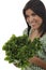 Woman holding an green endive salad