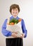 Woman holding grocery bag full of fresh fruit