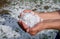 Woman holding hail stones in hands