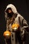 Woman holding halloween pumpkins