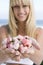 Woman holding handful of flower buds