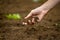 Woman holding a handful of rich fertile soil