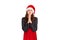 Woman is holding hands together like praying. emotional girl in santa claus christmas hat isolated on white background. holiday co