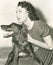 A woman holding her Irish setter