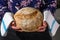 Woman holding homemade whole grain bread in her hands 5