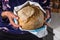 Woman holding homemade whole grain bread in her hands 7