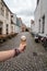 Woman holding an ice cream against medieval cityscape