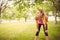 Woman holding knees in park