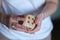 woman holding a large, enticing dice in her hands. Mysterious lady grasps an oversized gaming dice, ready for action