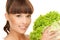 Woman holding lettuce