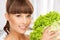 Woman holding lettuce