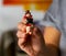 Woman is holding a lucky charm in her hand, a chimney sweep on a pig