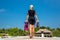 Woman holding mask and flippers for swimming on wooden pier