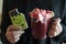 Woman holding monster halloween biscuit missing a bite and scary halloween beverage