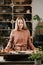 Woman holding palo santo during meditation