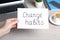 Woman holding paper note with phrase Break Bad Habits at table, closeup